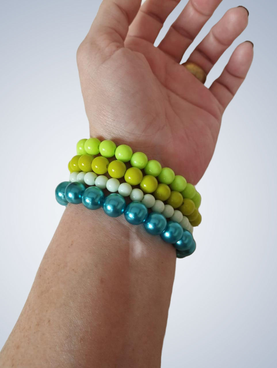 Mix de 4 pulseiras em tons de verde