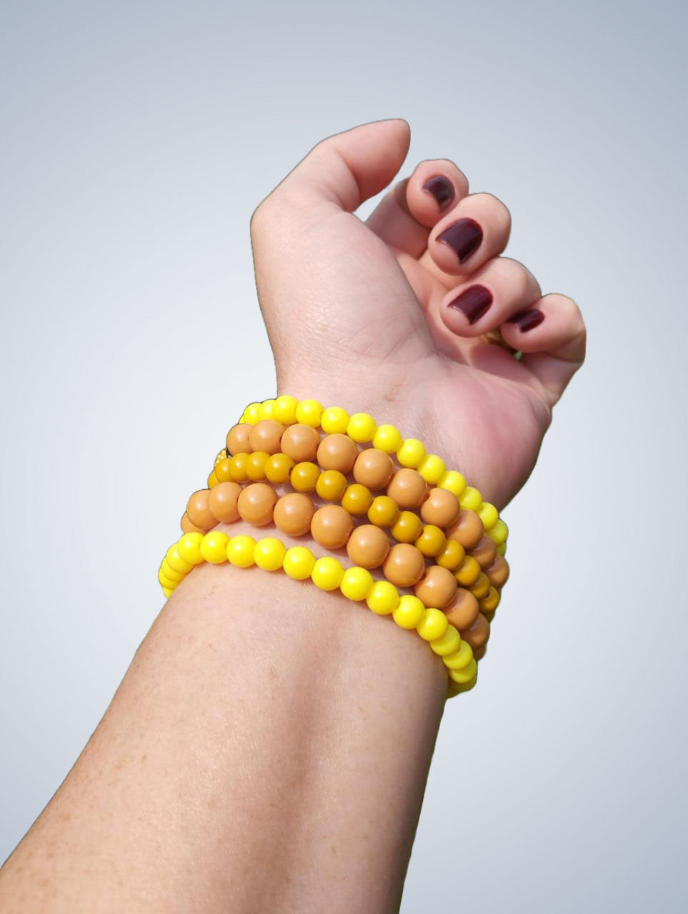 Mix de 5 pulseiras em tons de amarelo
